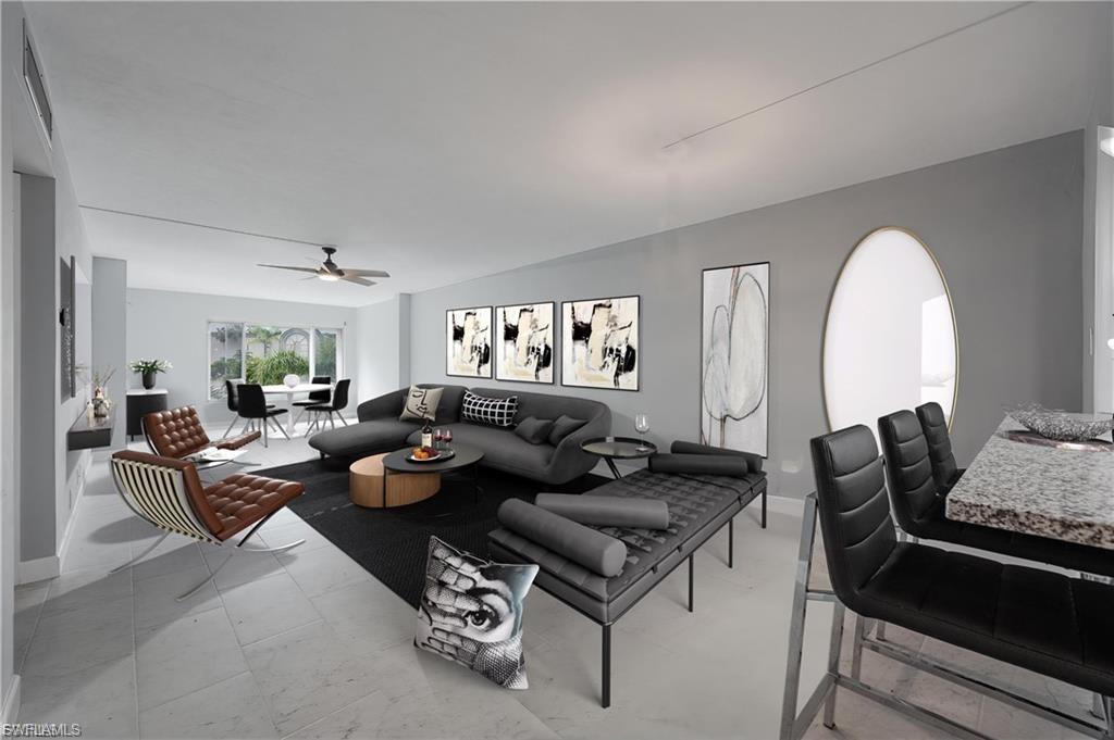 Living room with ceiling fan and baseboards