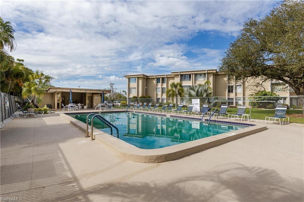 Community pool with a patio
