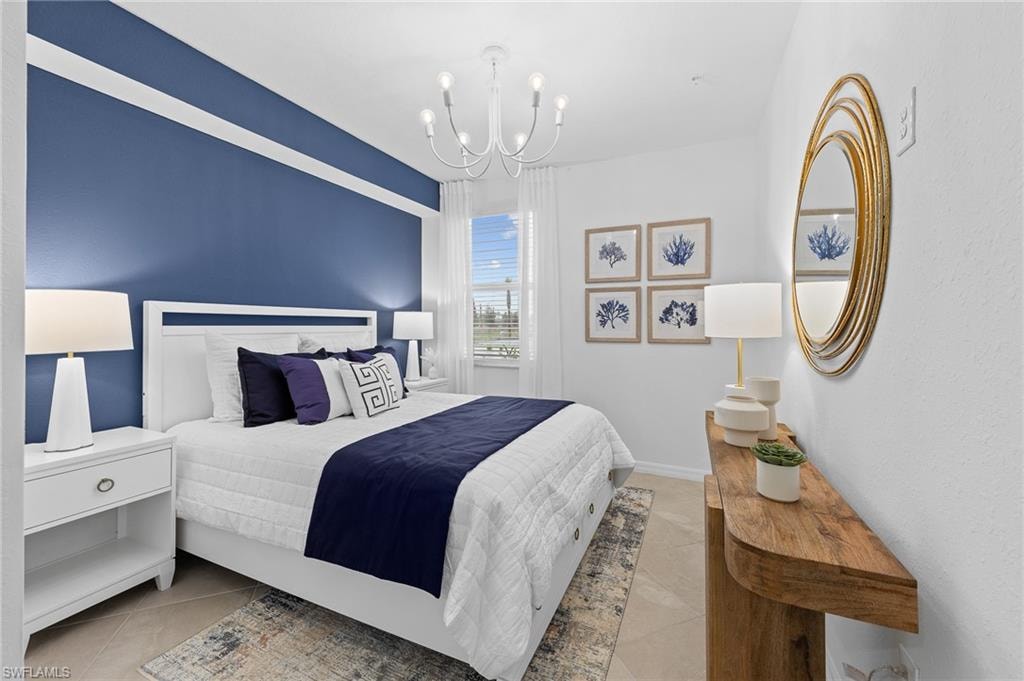 Tiled bedroom with a chandelier