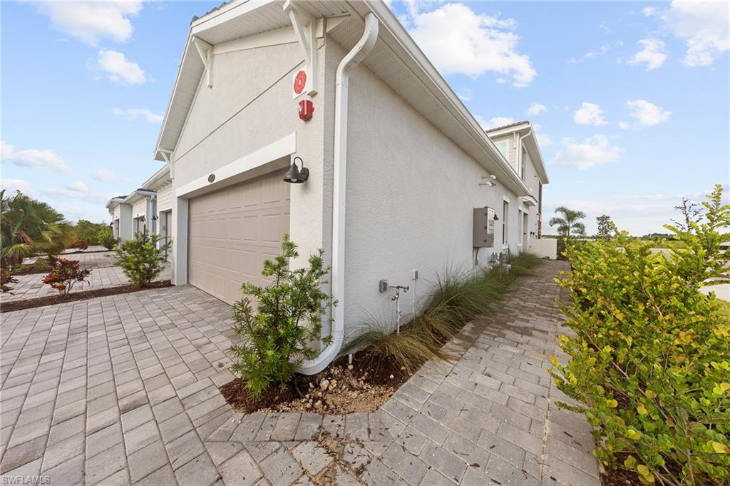 View of property exterior featuring stucco siding