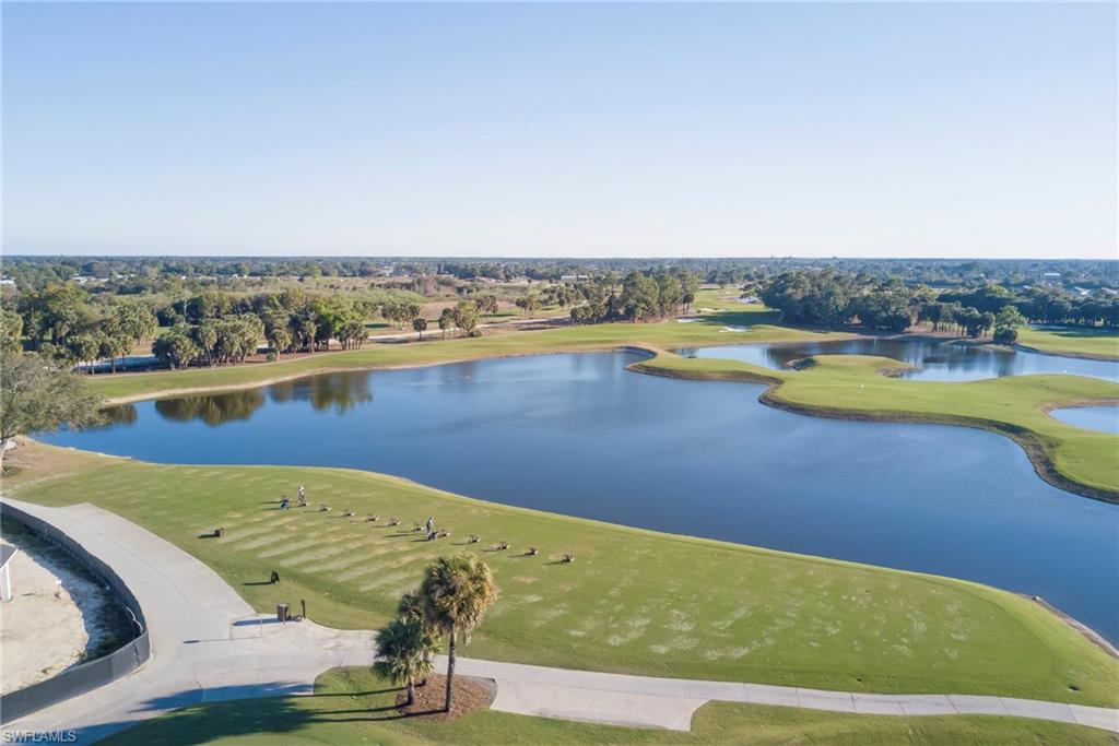Aerial view of a local golf course and a large body of water