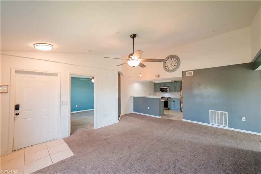 Unfurnished great room with vaulted ceilings