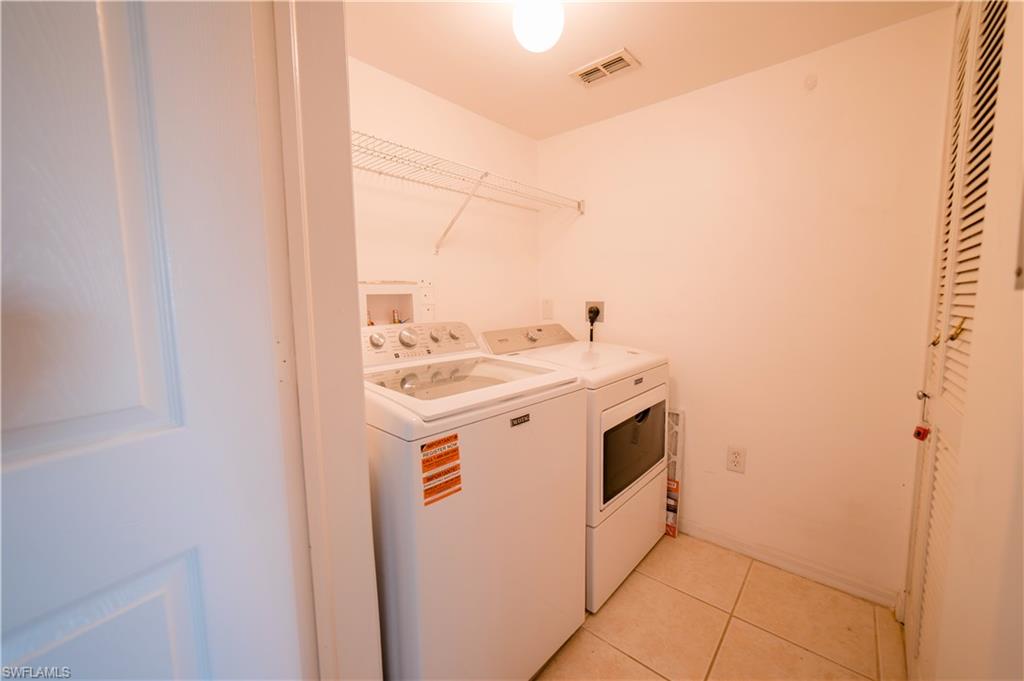 Inside laundry room off kitchen with room for pantry items