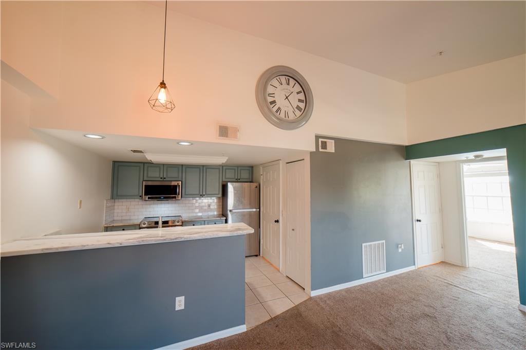 Updated Kitchen featuring stainless steel appliances and quartz countertops