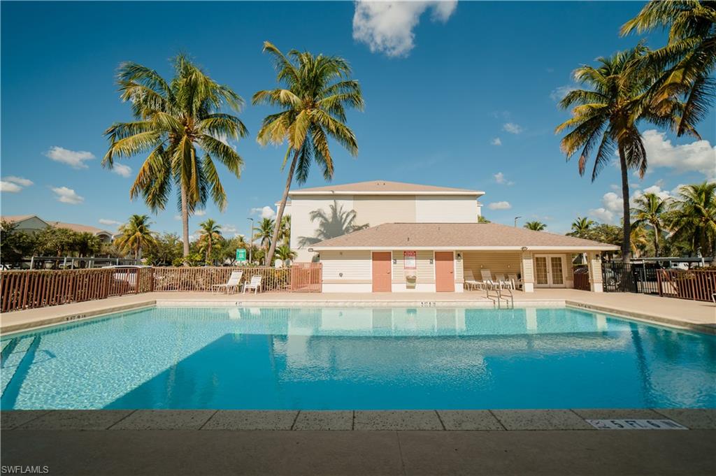 Community pool with a patio