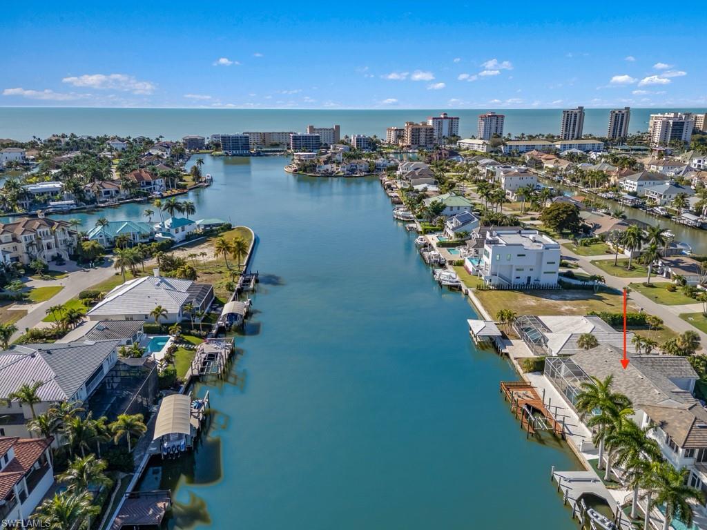 Aerial view of residential area with a nearby body of water