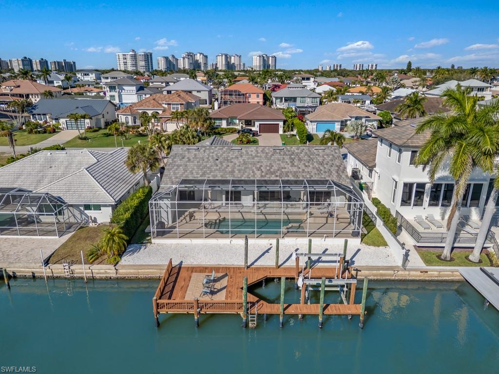 Drone / aerial view of skyline and a nearby body of water
