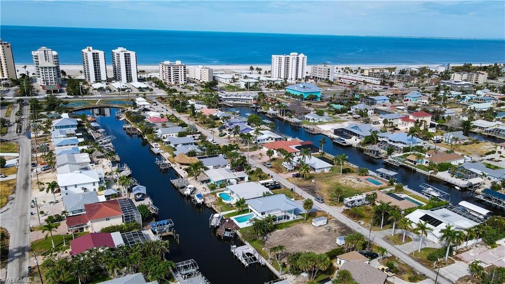 Lot is on the right with canal view to open water of Gulf of Mexico