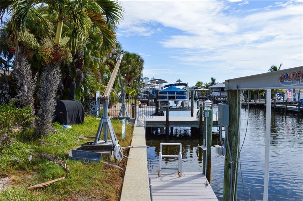 Davits on dock for small watercraft.