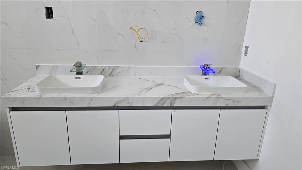 Full bathroom with double vanity
