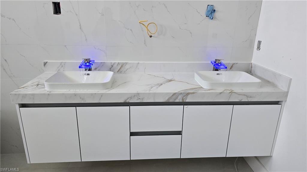 Bathroom featuring double vanity