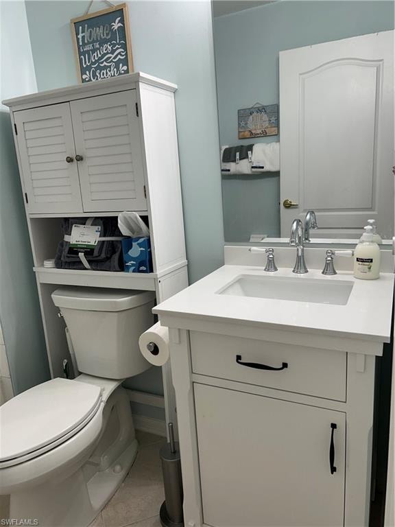 Guest bathroom featuring a white vanity