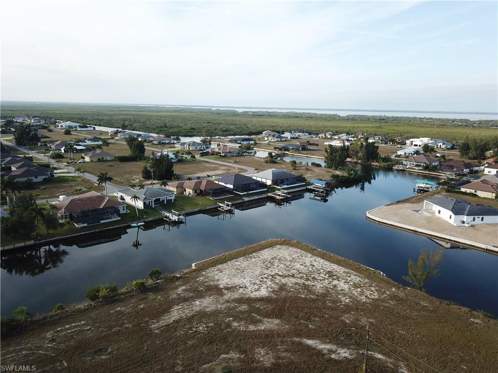 Aerial view of residential area with a large body of water