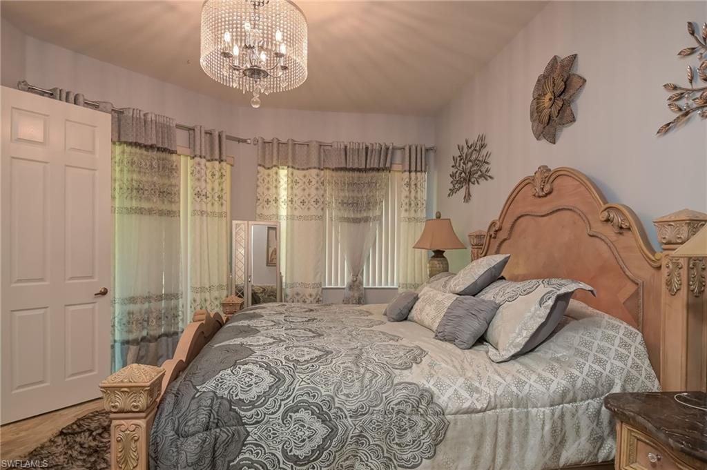 Bedroom featuring a chandelier