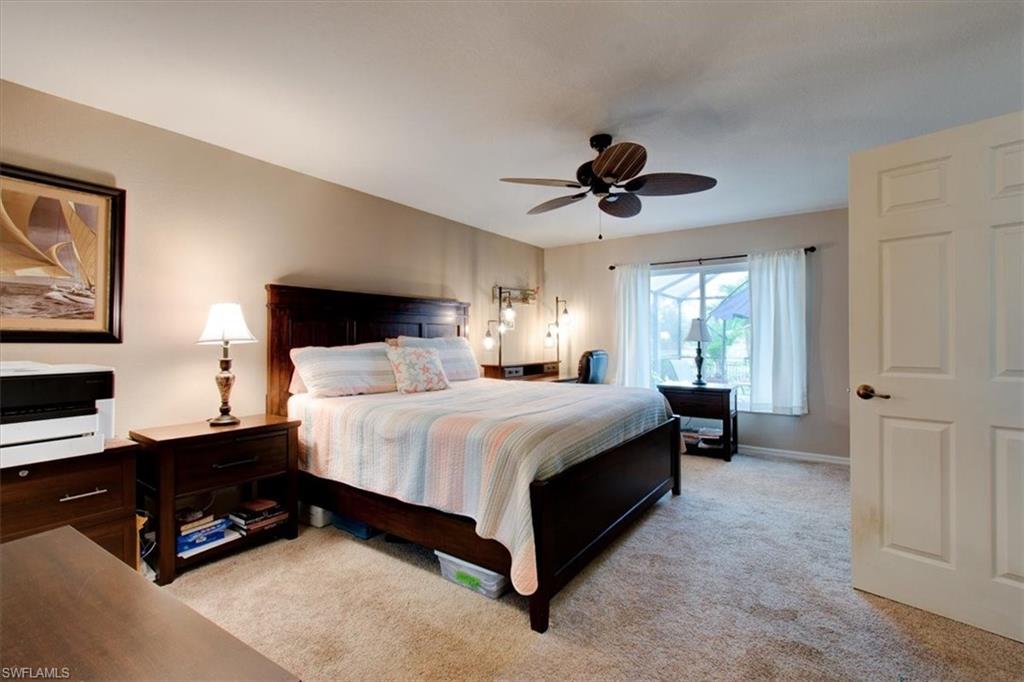 Bedroom with light carpet and ceiling fan