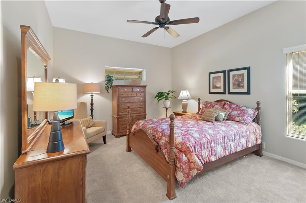 Primary bedroom with lush carpeting