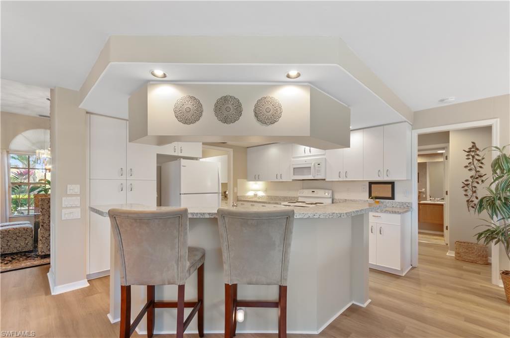 Kitchen has abundance of recessed lighting