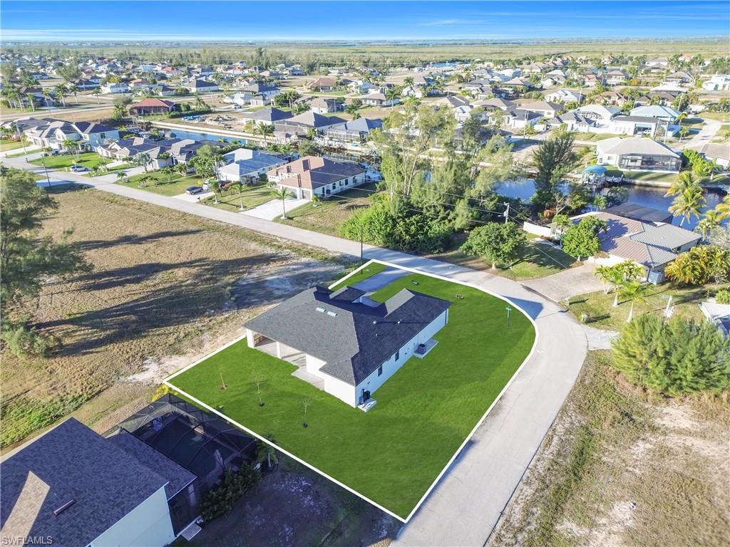 Aerial overview of property's location featuring nearby suburban area