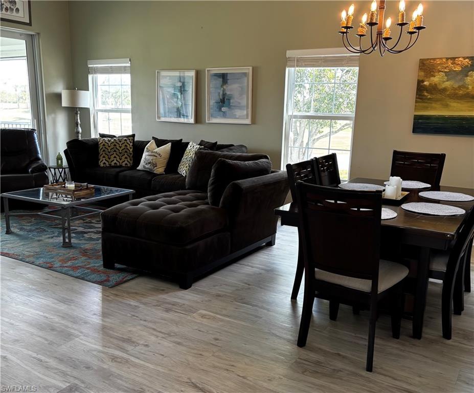Dining space featuring a chandelier and light wood-style floors