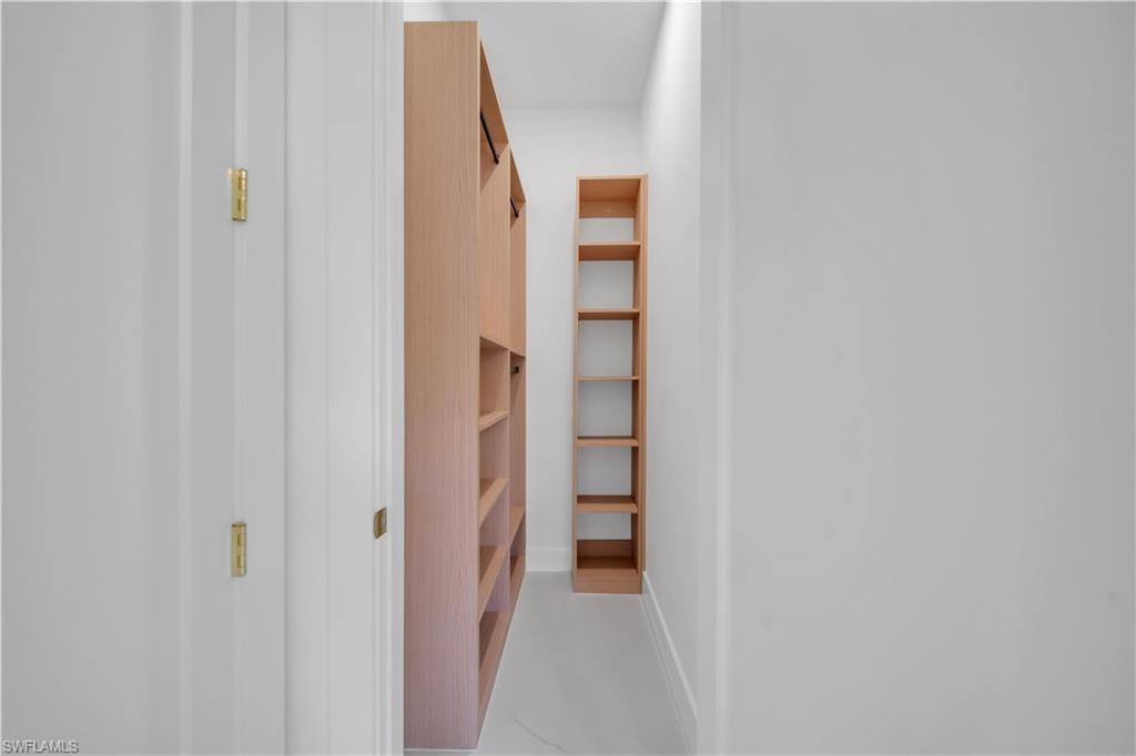Built-in wood-finish shelving and storage cabinetry