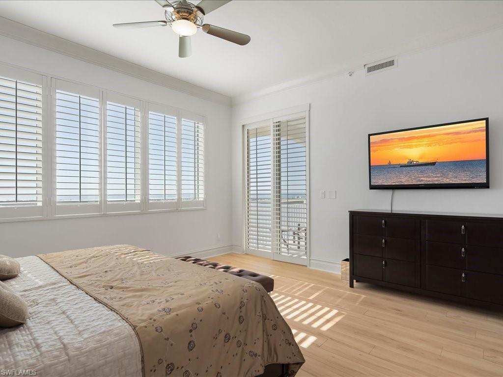 Bedroom featuring access to outside, light wood-style flooring, ceiling fan, and crown molding