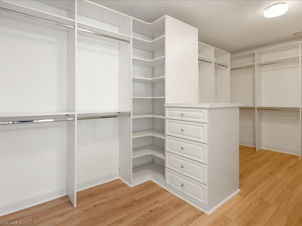 Walk in closet featuring light wood-style floors