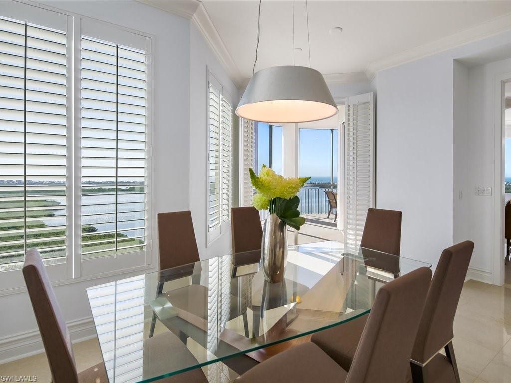 Dining area featuring crown molding