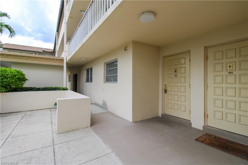 Doorway to property with a balcony