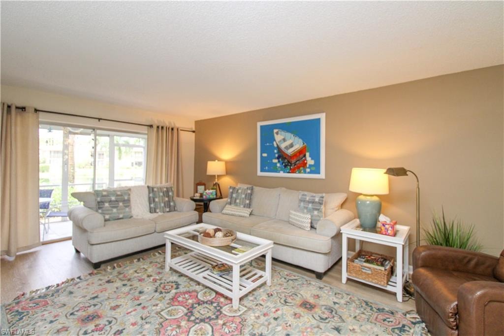 Living room with light hardwood / wood-style floors