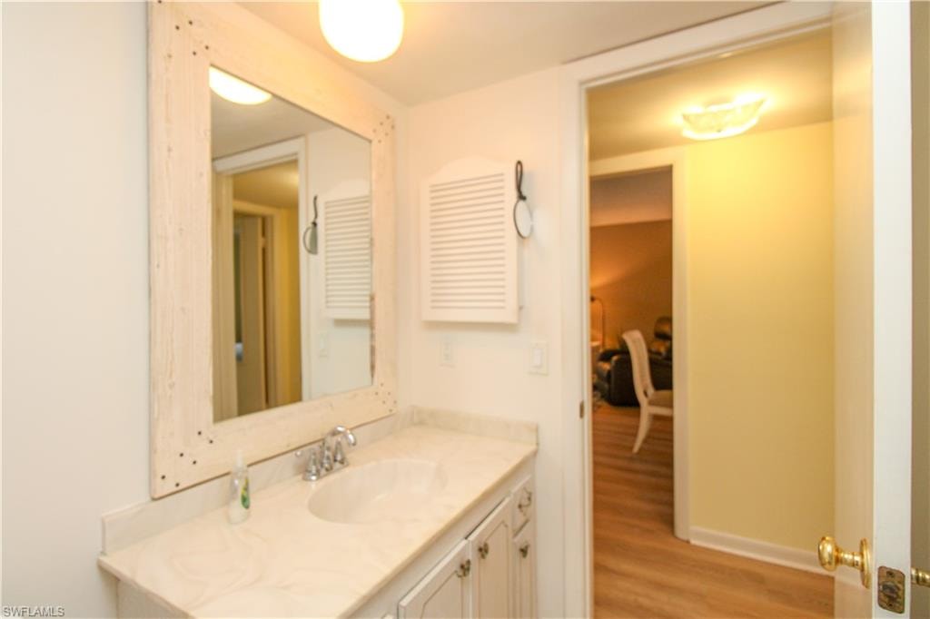 Bathroom featuring vanity and hardwood / wood-style floors