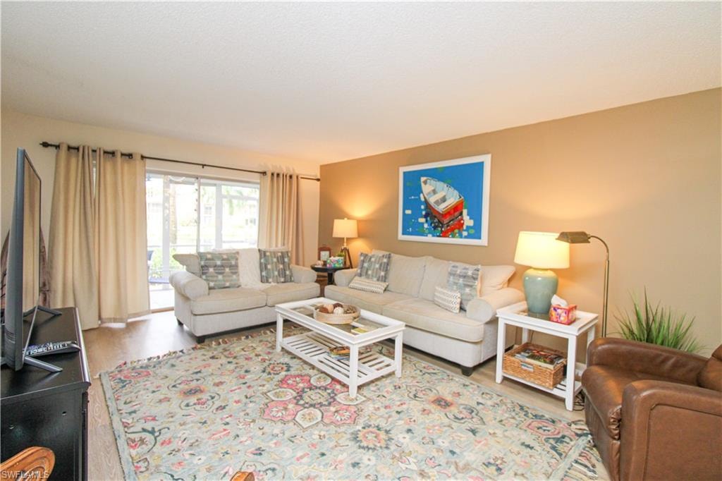 Living room with light wood-type flooring