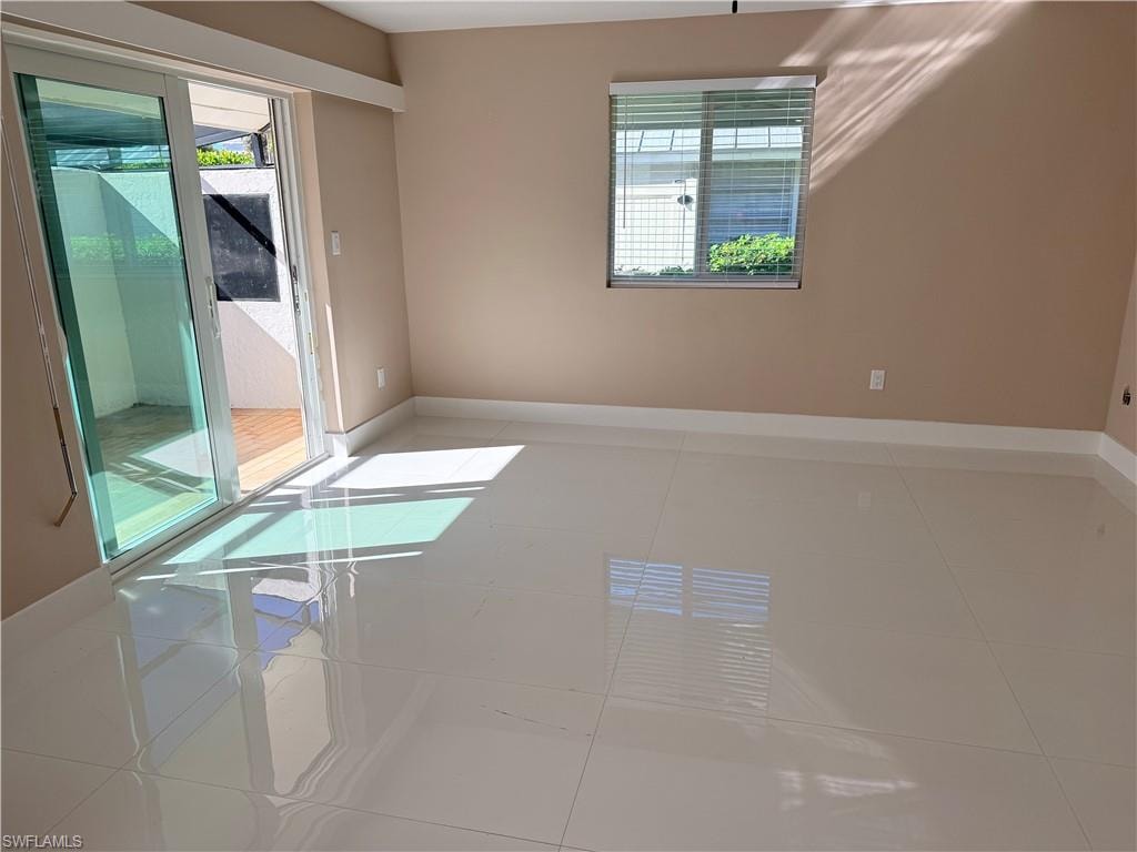 Great room  plenty of natural light, and large light tile floors leading out to your private lanai.