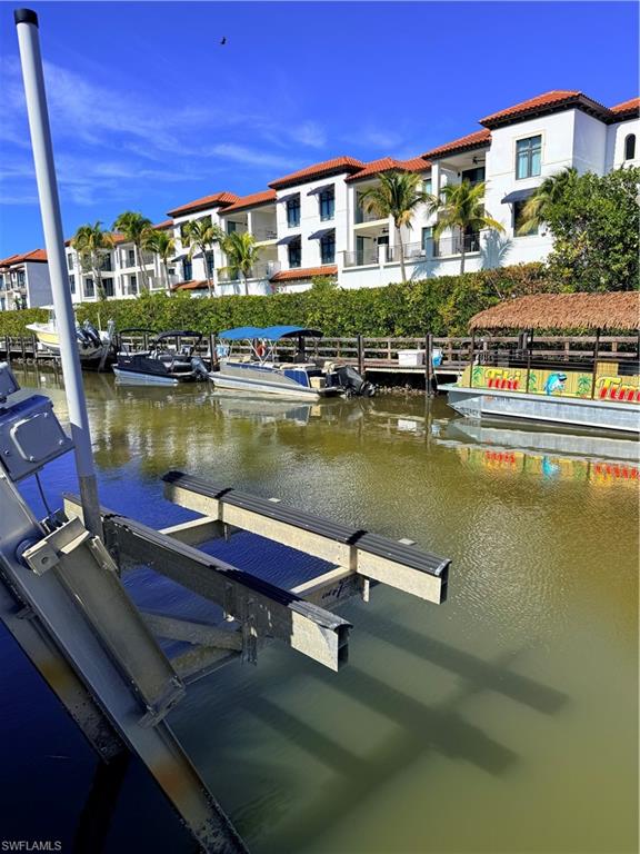 Dock area with  electric boat lift and water view