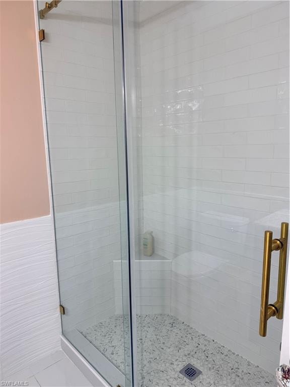Guest Full bath featuring a stall shower
