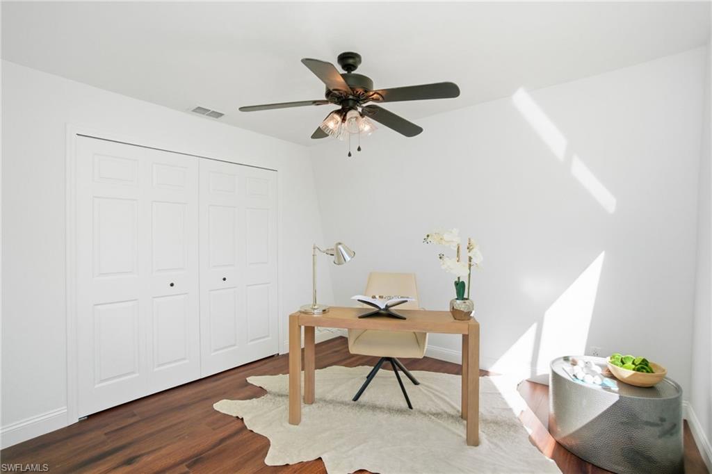4th downstairs bedroom staged as an office.