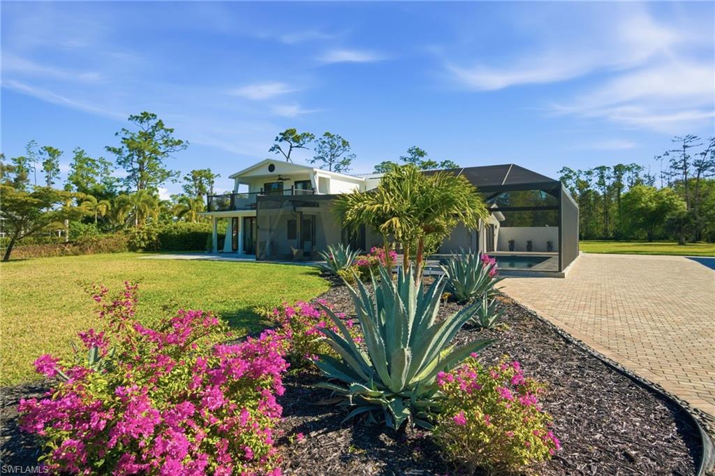 New sod, landscaping, sprinkler system and stone driveway are part of what gives this home such beauty