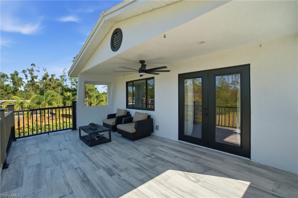 Spacious tile, 2nd floor balcony deck has sunrise exposure and privacy that is exclusive to the primary suite.