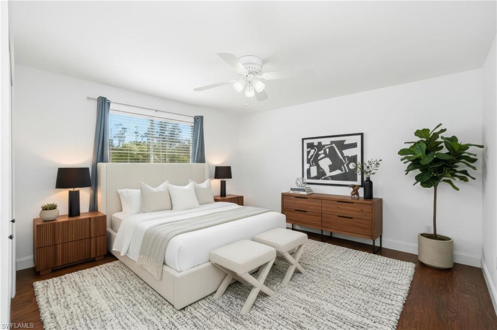3rd guest Bedroom is bright and open with rich contrasting wood flooring setting off the crisp white walls.