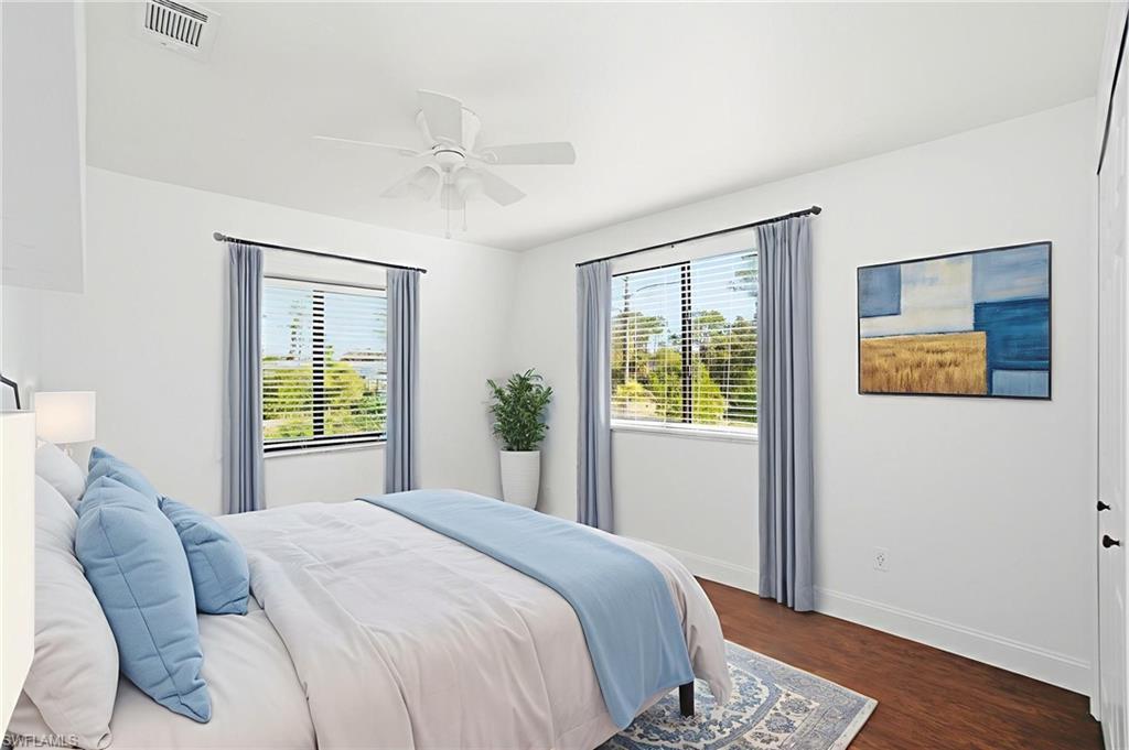 2 of 3 guest bedrooms upstairs is modern and bright with espresso wood flooring in all bedrooms and mean space