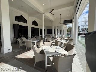 Deck featuring a patio area, ceiling fan, and outdoor dining area