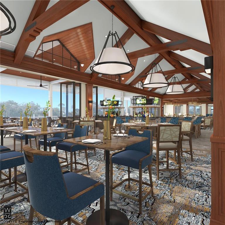 Dining room with beamed ceiling and high vaulted ceiling