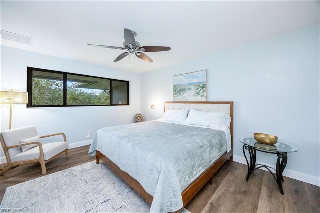 Bedroom with wood finished floors and a ceiling fan