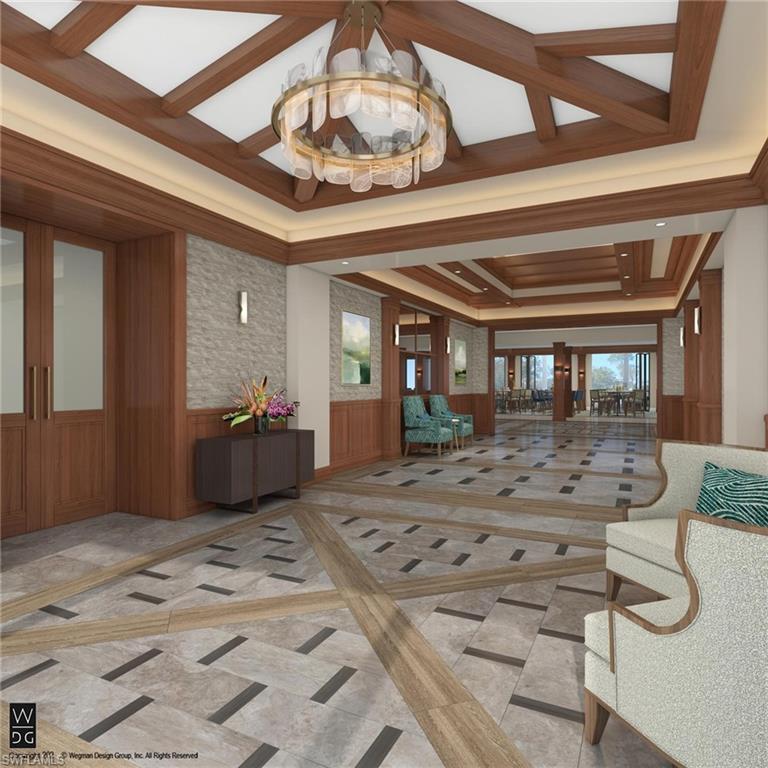 Community lobby featuring a wainscoted wall and wood walls