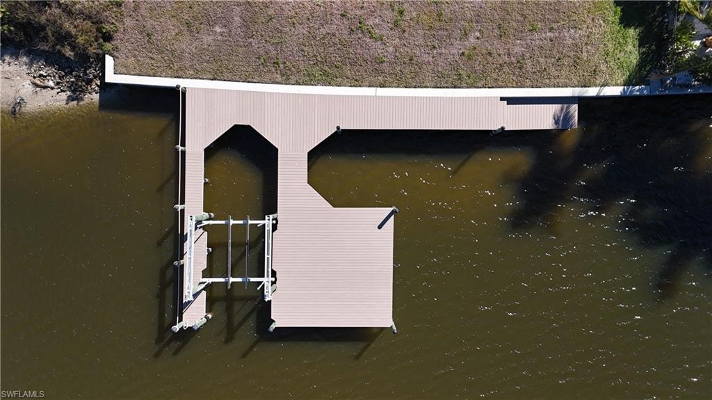 Composite dock, 10,000 lb lift and boat slip for larger boat.