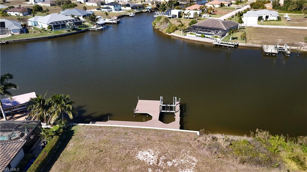 Aerial perspective of suburban area with a large body of water
