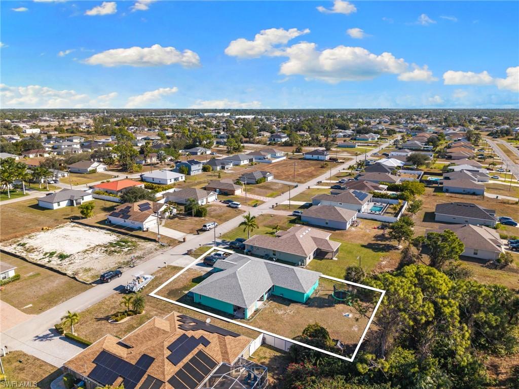 Aerial view of residential area with property parcel outlined