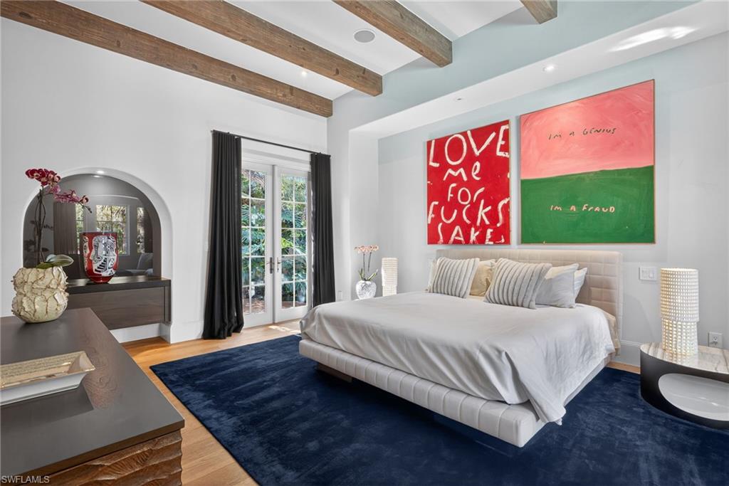 Bedroom featuring beamed ceiling, french doors, access to outside, wood finished floors, and recessed lighting