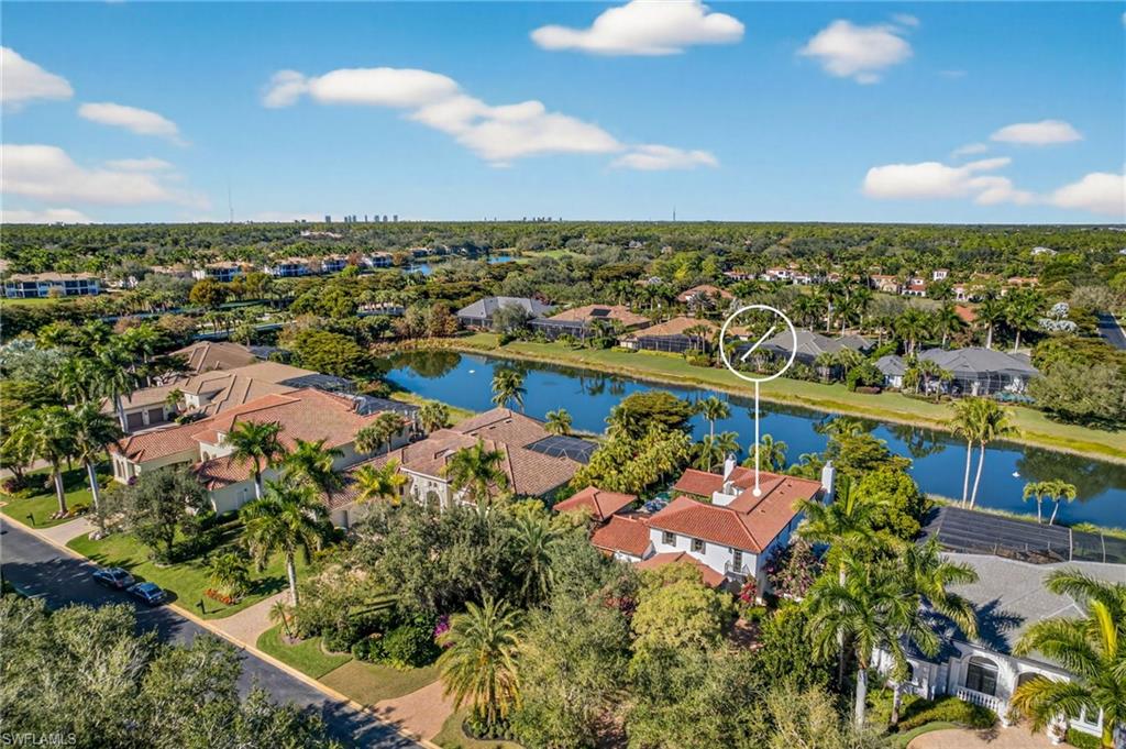 View of property location featuring a nearby body of water and nearby suburban area