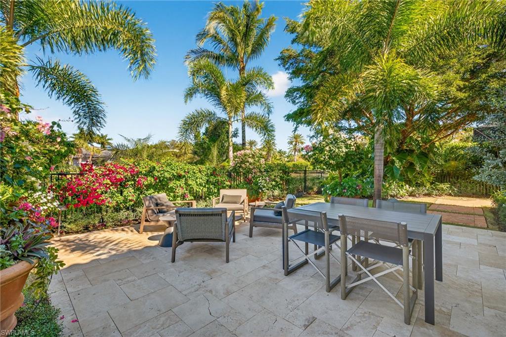Fenced backyard with an outdoor living space, outdoor dining space, and a patio