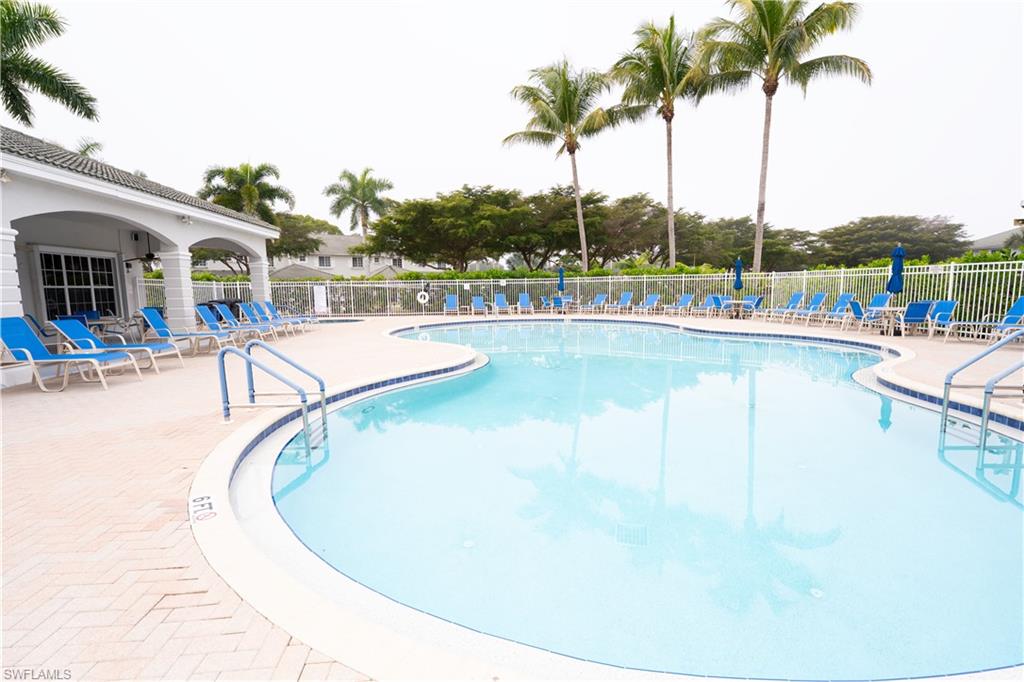 Community pool featuring a patio